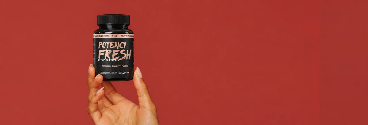 Hand holding a bottle of Potency Fresh