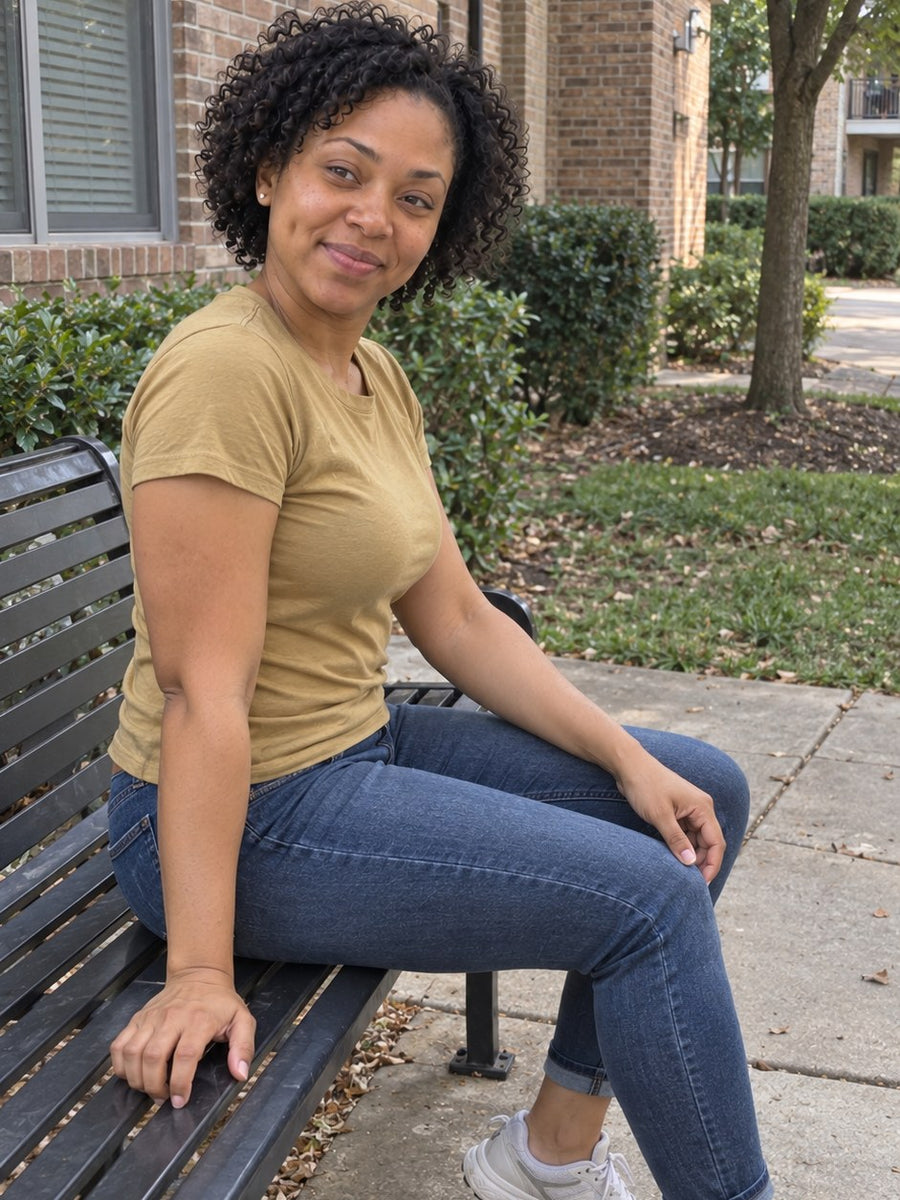 The same woman relaxed on a bench outside