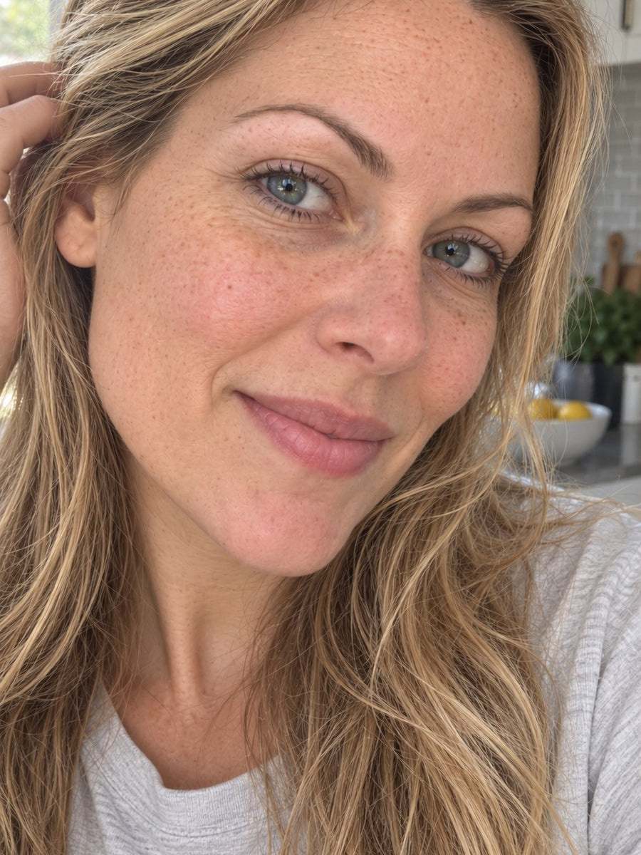 The same woman with brighter, hydrated-looking skin